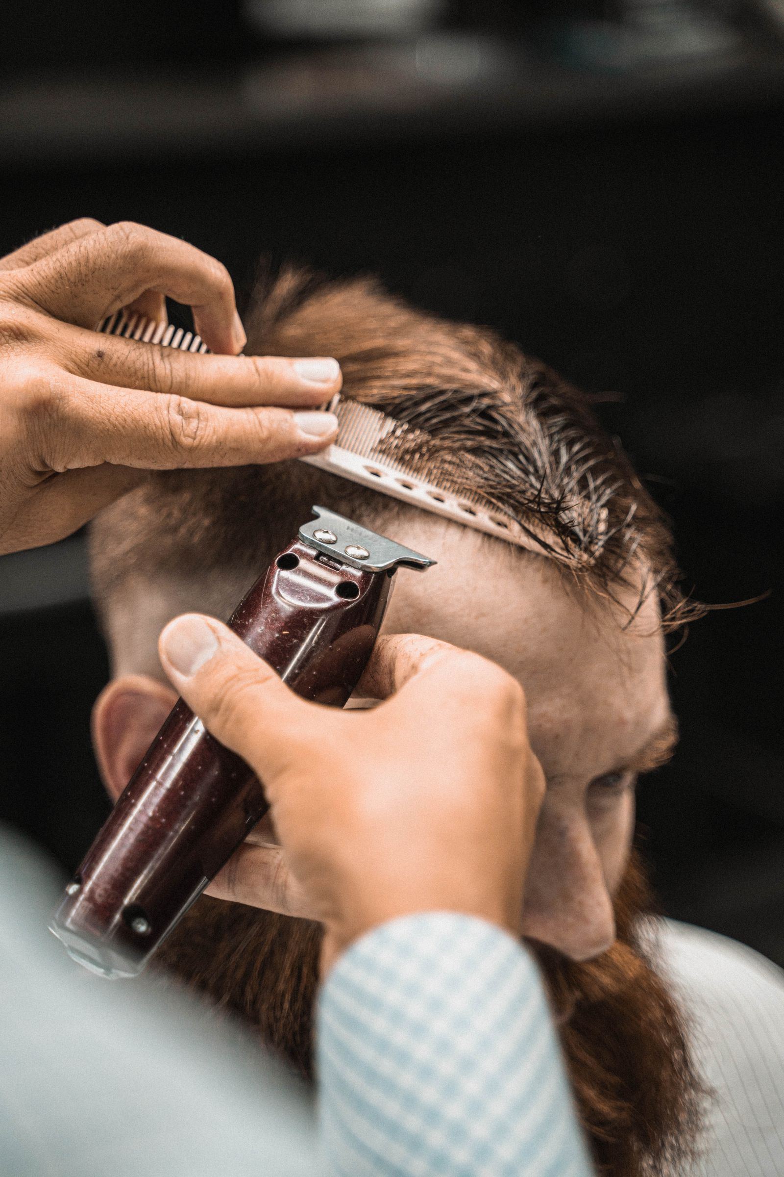 Barber working on a fade; concept placeholder photography